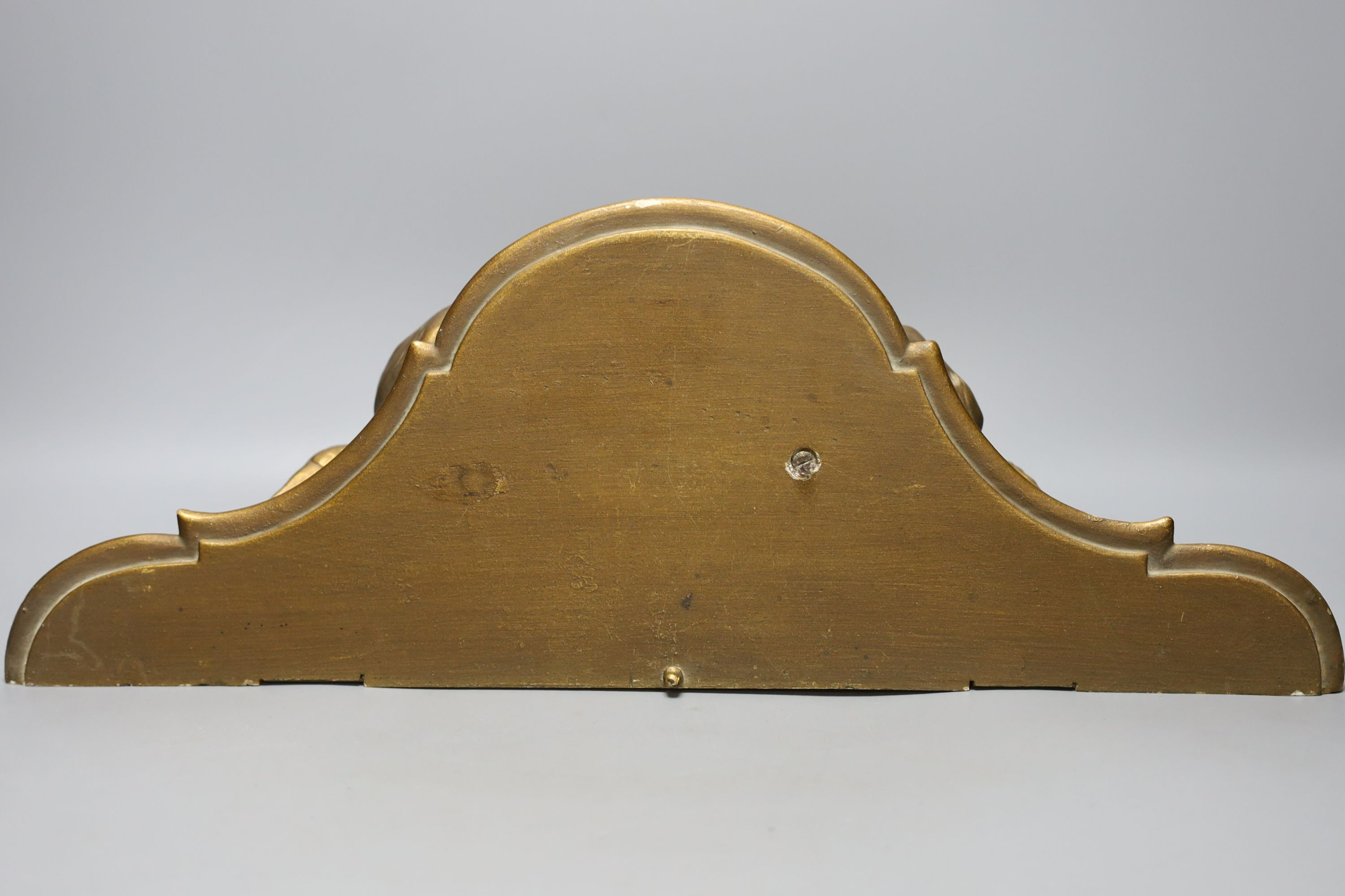 A giltwood cherub bracket 51cm wide